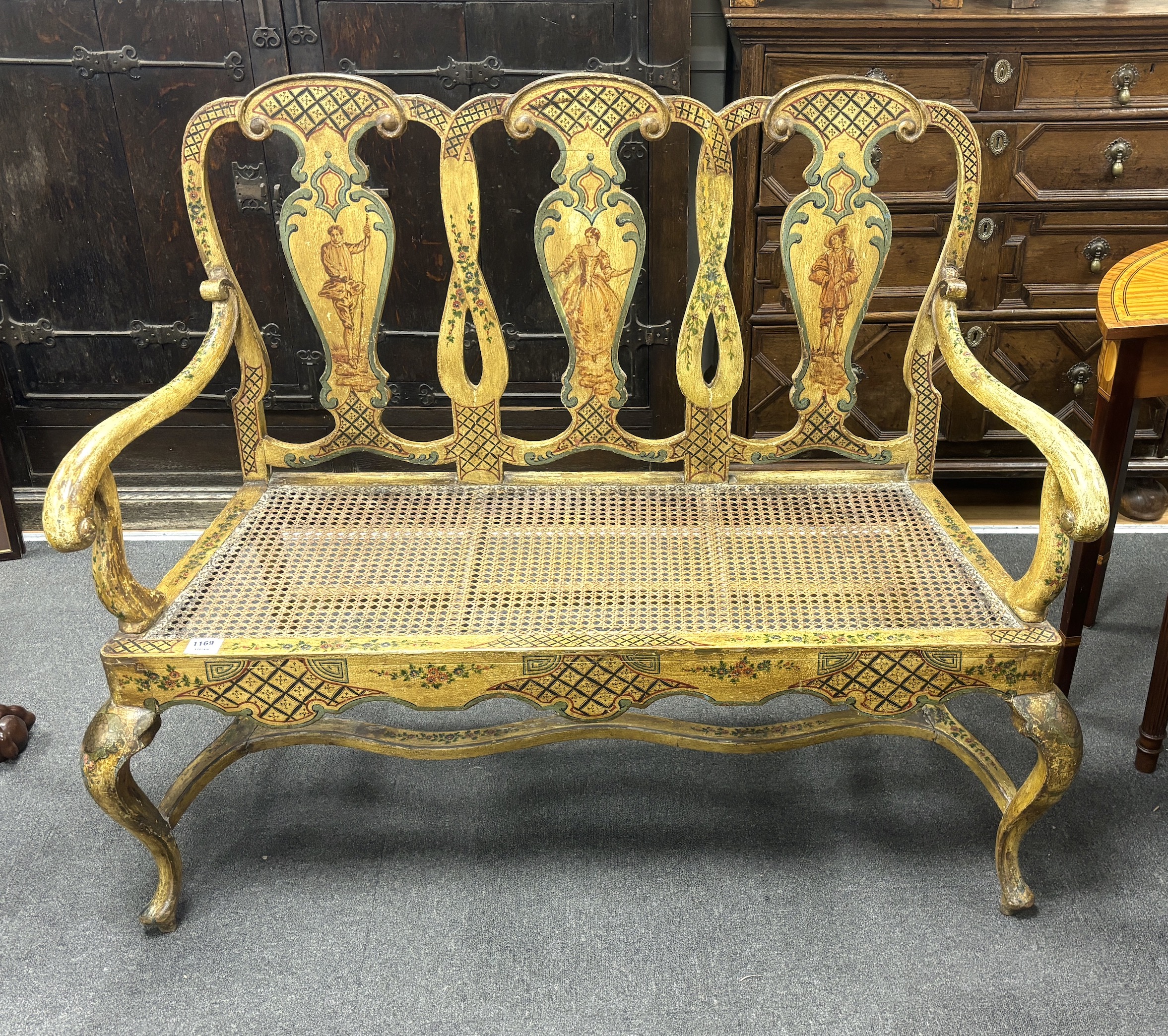 An 18th century style Italian painted and caned seat chair back settee, width 123cm, depth 49cm, height 106cm